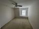 Upstairs bedroom with window seat and neutral walls at 7533 Merchantville Cir, Zephyrhills, FL 33540