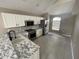 Modern kitchen with stainless steel appliances and marble countertops at 7533 Merchantville Cir, Zephyrhills, FL 33540