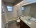 Bathroom featuring a shower/tub combo, toilet, and a vanity with mirror at 7724 St Andrews Blvd, Weeki Wachee, FL 34613