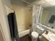 Clean bathroom with a shower/tub combo and a toilet at 7724 St Andrews Blvd, Weeki Wachee, FL 34613