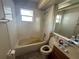 Bathroom with a bathtub, toilet, and vanity at 7724 St Andrews Blvd, Weeki Wachee, FL 34613