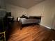 Bedroom with a bed and dark wood flooring at 7724 St Andrews Blvd, Weeki Wachee, FL 34613