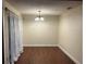 Dining room with chandelier, and hardwood floors at 7724 St Andrews Blvd, Weeki Wachee, FL 34613