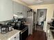 Kitchen with stainless steel appliances and gray cabinets at 7724 St Andrews Blvd, Weeki Wachee, FL 34613