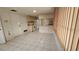 Bright dining area adjacent to the kitchen with wood wall accents at 7930 Valmy Ln, Port Richey, FL 34668