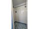 Shower stall with blue and white tile at 7930 Valmy Ln, Port Richey, FL 34668