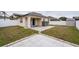 Home's backyard features a patio and storage shed at 7943 Merchantville Cir, Zephyrhills, FL 33540