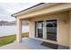 Covered patio with sliding glass doors at 7943 Merchantville Cir, Zephyrhills, FL 33540