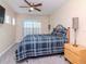 Spacious bedroom with large window and ceiling fan at 8811 Casablanca Way # 106, Tampa, FL 33626