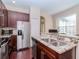 Updated kitchen with double sink, stainless steel appliances, and island at 8811 Casablanca Way # 106, Tampa, FL 33626