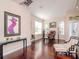 Bright living room with hardwood floors, comfy seating, and large windows at 8811 Casablanca Way # 106, Tampa, FL 33626