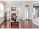 Living room with hardwood floors, large windows, and comfortable seating at 8811 Casablanca Way # 106, Tampa, FL 33626