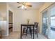 Bright dining area with table and chairs, near sliding glass door at 9070 Bryan Dairy Rd, Seminole, FL 33777