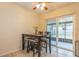 Dining area with a dark brown table and four chairs, near sliding door at 9070 Bryan Dairy Rd, Seminole, FL 33777