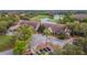 Aerial view of clubhouse near golf course and lake at 9144 Highland Ridge Way, Tampa, FL 33647