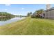 Grass lawn backyard with lake view at 9144 Highland Ridge Way, Tampa, FL 33647