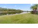 Landscaped backyard with lake view at 9144 Highland Ridge Way, Tampa, FL 33647