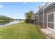 Landscaped backyard with lake view and privacy at 9144 Highland Ridge Way, Tampa, FL 33647