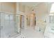 Bright bathroom with double vanity, large shower and a separate tub at 9144 Highland Ridge Way, Tampa, FL 33647