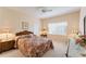 Cozy bedroom with floral bedding and double closets at 9144 Highland Ridge Way, Tampa, FL 33647