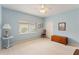 Spacious bedroom featuring light blue walls and ample floor space at 9144 Highland Ridge Way, Tampa, FL 33647