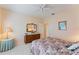 Bright bedroom with carpeted floor, dresser, and ceiling fan at 9144 Highland Ridge Way, Tampa, FL 33647