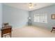 Light blue bedroom with a ceiling fan and window blinds at 9144 Highland Ridge Way, Tampa, FL 33647