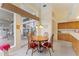 Kitchen breakfast nook with wood table and chairs, overlooking pool at 9144 Highland Ridge Way, Tampa, FL 33647