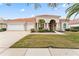 Attractive single-story home with tile roof and two-car garage at 9144 Highland Ridge Way, Tampa, FL 33647