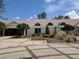 Clubhouse exterior with landscaping and brick driveway at 9144 Highland Ridge Way, Tampa, FL 33647