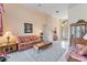 Spacious living room featuring a floral sofa and coffee table at 9144 Highland Ridge Way, Tampa, FL 33647