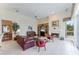 Relaxing living room with fireplace, leather sofa, and built-in shelving at 9144 Highland Ridge Way, Tampa, FL 33647