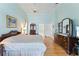 Spacious main bedroom with hardwood floors and ensuite bathroom at 9144 Highland Ridge Way, Tampa, FL 33647