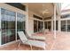 Screened patio with lounge chairs and a view of the pool at 9144 Highland Ridge Way, Tampa, FL 33647