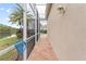 Enclosed pool area with brick pavers and lake view at 9144 Highland Ridge Way, Tampa, FL 33647