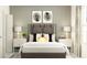 Bedroom with gray upholstered bed and white nightstands at 9189 Bonita Mar Dr, Parrish, FL 34219