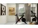 Home gym with stationary bike and full-length mirror at 9189 Bonita Mar Dr, Parrish, FL 34219