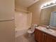 Clean bathroom with a tub, toilet, and vanity at 9521 Grovedale Cir # 201, Riverview, FL 33578