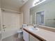 Clean bathroom with a bathtub, toilet and vanity at 9521 Grovedale Cir # 201, Riverview, FL 33578