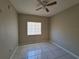 Bright bedroom with tile flooring and a ceiling fan at 9521 Grovedale Cir # 201, Riverview, FL 33578