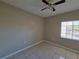 Well-lit bedroom with tile floors and a ceiling fan at 9521 Grovedale Cir # 201, Riverview, FL 33578