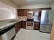 Modern kitchen with stainless steel appliances and granite countertops at 9521 Grovedale Cir # 201, Riverview, FL 33578