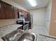 Modern kitchen with stainless steel appliances and granite countertops at 9521 Grovedale Cir # 201, Riverview, FL 33578