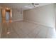 Spacious living room with tile floors and chandelier at 9521 Grovedale Cir # 201, Riverview, FL 33578