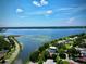 Aerial image of the property highlighting waterfront location with expansive water views under a bright blue sky at 963 27Th S Ave, St Petersburg, FL 33705