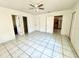 Bedroom with tile floors and multiple doors at 963 27Th S Ave, St Petersburg, FL 33705