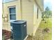 House exterior showcasing a new AC unit and a well-maintained yard at 963 27Th S Ave, St Petersburg, FL 33705