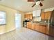 Kitchen with wood cabinets and tile floors at 963 27Th S Ave, St Petersburg, FL 33705