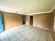 Living room with tile floors and blue door at 963 27Th S Ave, St Petersburg, FL 33705