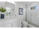 Clean bathroom with single vanity, shower, and updated fixtures at 2203 Avenue B, Bradenton Beach, FL 34217